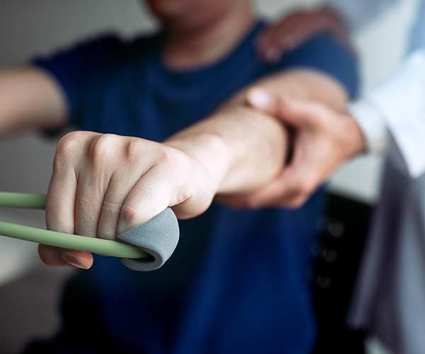 Physiotherapist treating an older patient