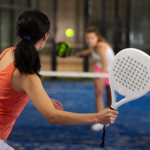 Ladies playing paddle tennis
